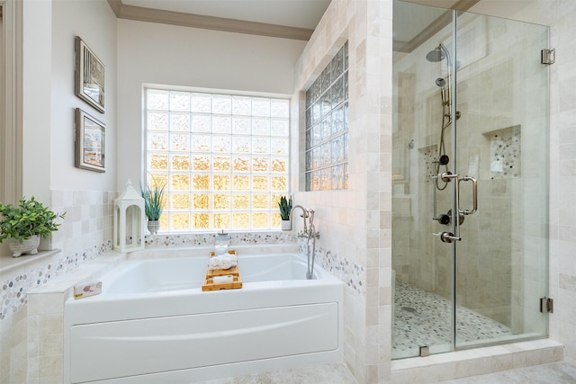 bathroom featuring a healthy amount of sunlight, a stall shower, ornamental molding, and a bath