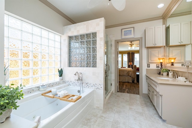 ensuite bathroom with a stall shower, crown molding, a jetted tub, and ensuite bathroom