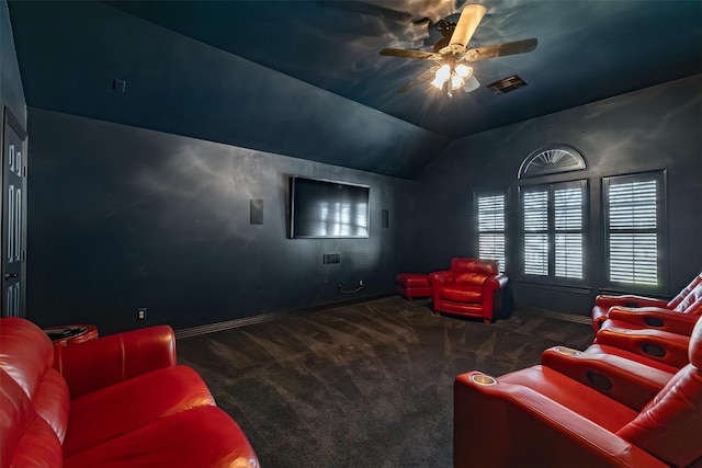 carpeted home theater with visible vents, vaulted ceiling, baseboards, and ceiling fan