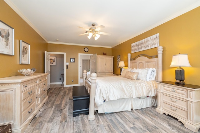 bedroom with light wood-type flooring, a ceiling fan, baseboards, and crown molding