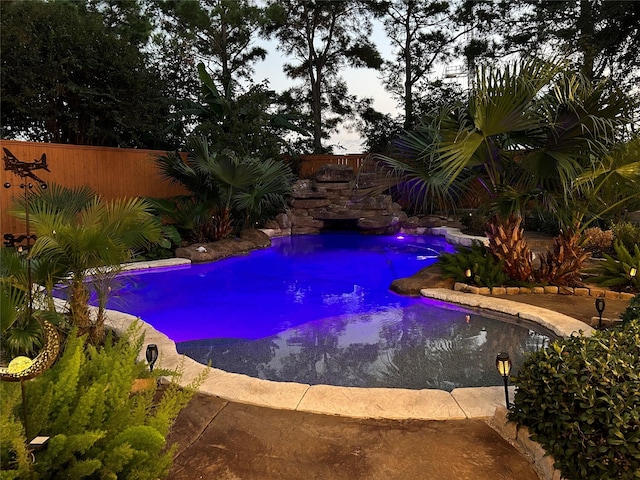 view of pool with fence and a fenced in pool