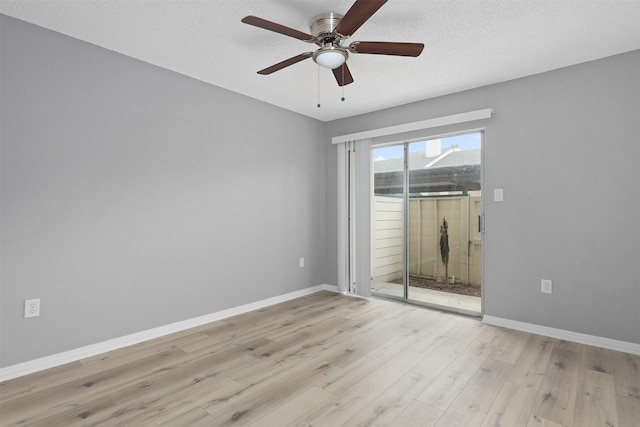 unfurnished room featuring ceiling fan, a textured ceiling, and light wood-type flooring