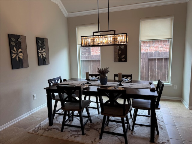 dining room featuring crown molding, light tile patterned floors, and a notable chandelier