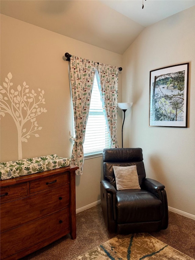 living area featuring light colored carpet and vaulted ceiling