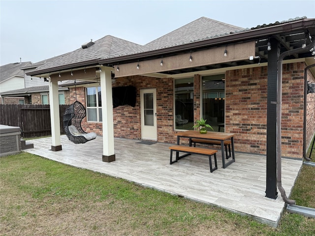 rear view of house with a wooden deck