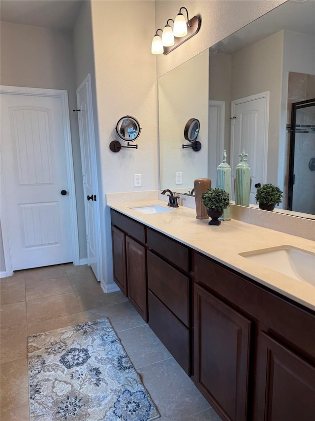 bathroom with walk in shower, tile patterned floors, and vanity