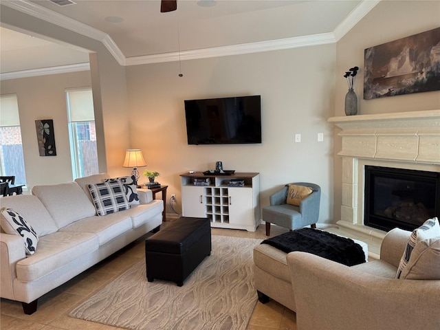 tiled living room with a premium fireplace and ornamental molding