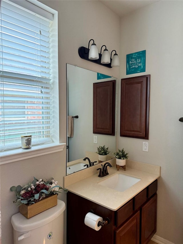 bathroom with vanity and toilet