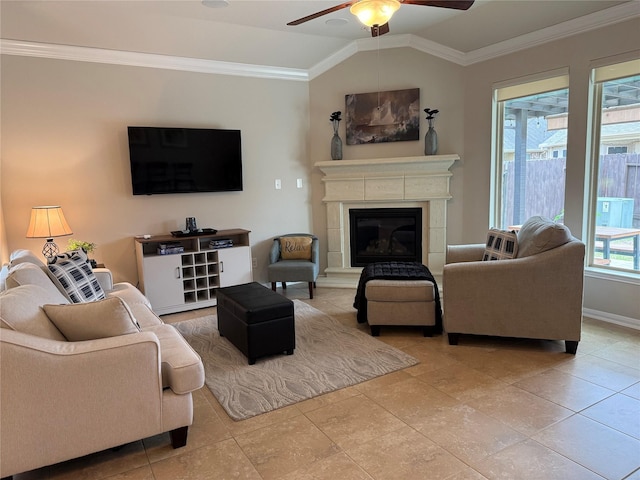 tiled living room with ornamental molding, vaulted ceiling, and ceiling fan