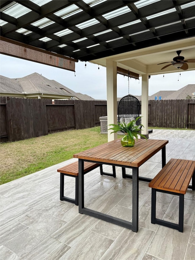 view of patio / terrace with ceiling fan and a pergola