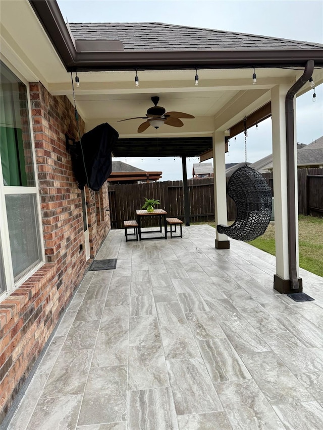 view of patio featuring ceiling fan