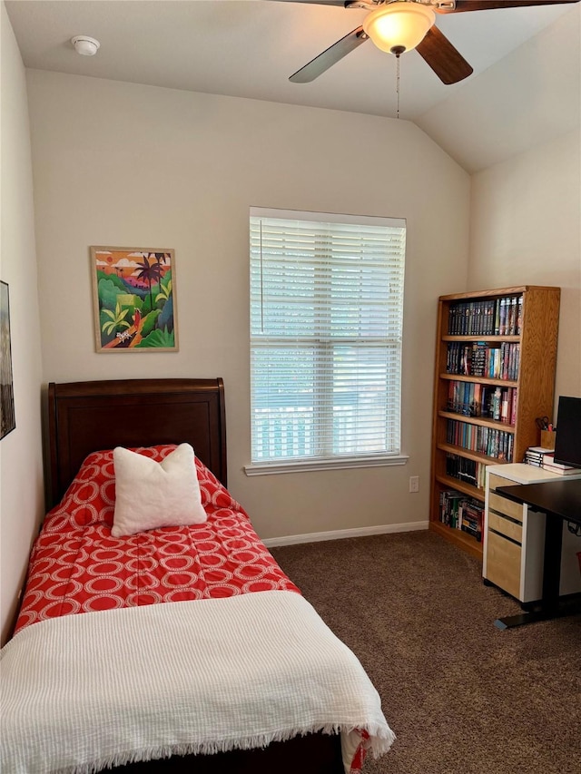 bedroom featuring lofted ceiling, ceiling fan, and dark colored carpet