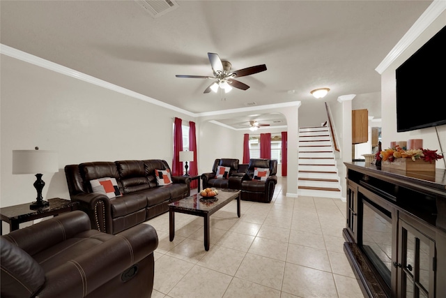 tiled living room with crown molding and ceiling fan