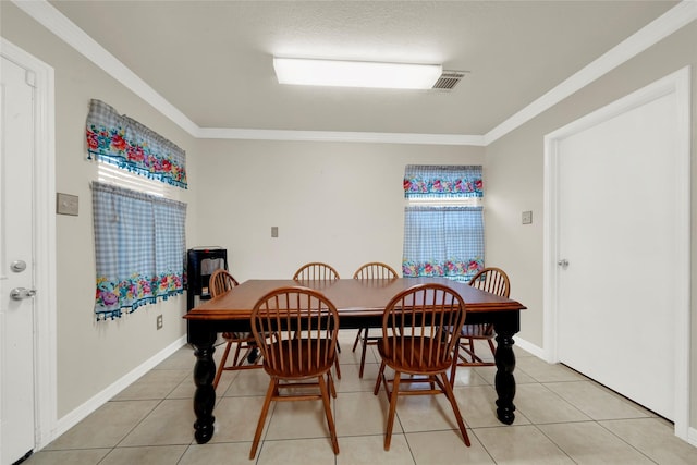 tiled dining area with crown molding