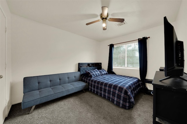 bedroom with ceiling fan and carpet