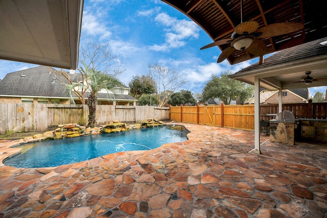 view of swimming pool featuring a fenced backyard, ceiling fan, a fenced in pool, and a patio