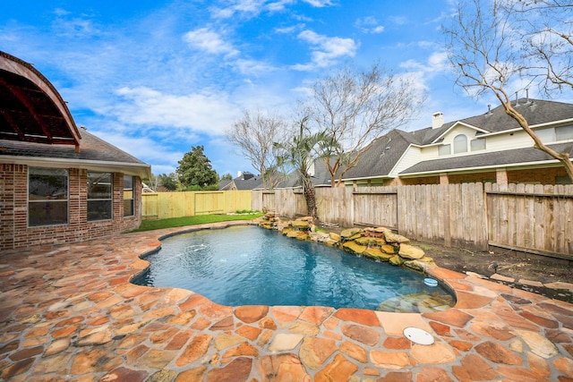 view of pool featuring a fenced in pool, a patio area, and a fenced backyard