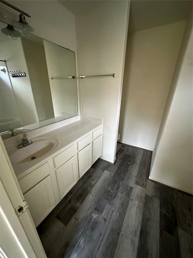 bathroom with wood-type flooring and vanity