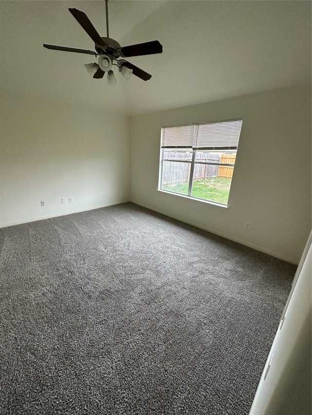 unfurnished room with ceiling fan, lofted ceiling, and carpet