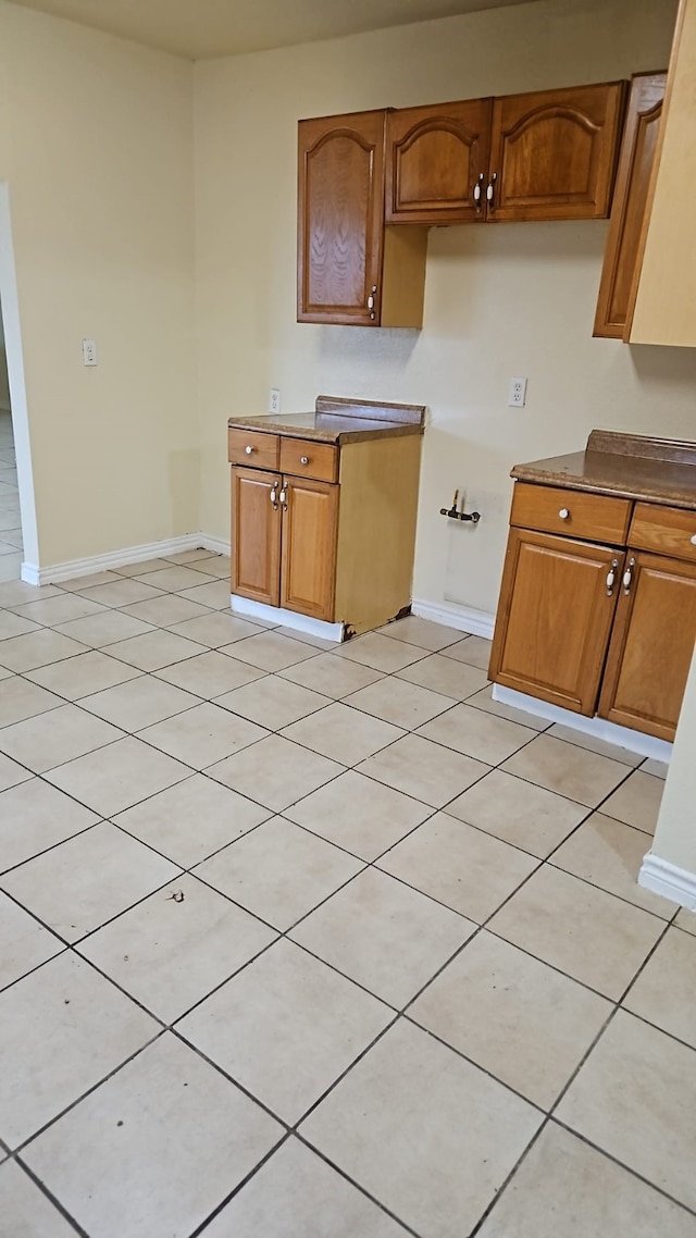 kitchen with light tile patterned floors