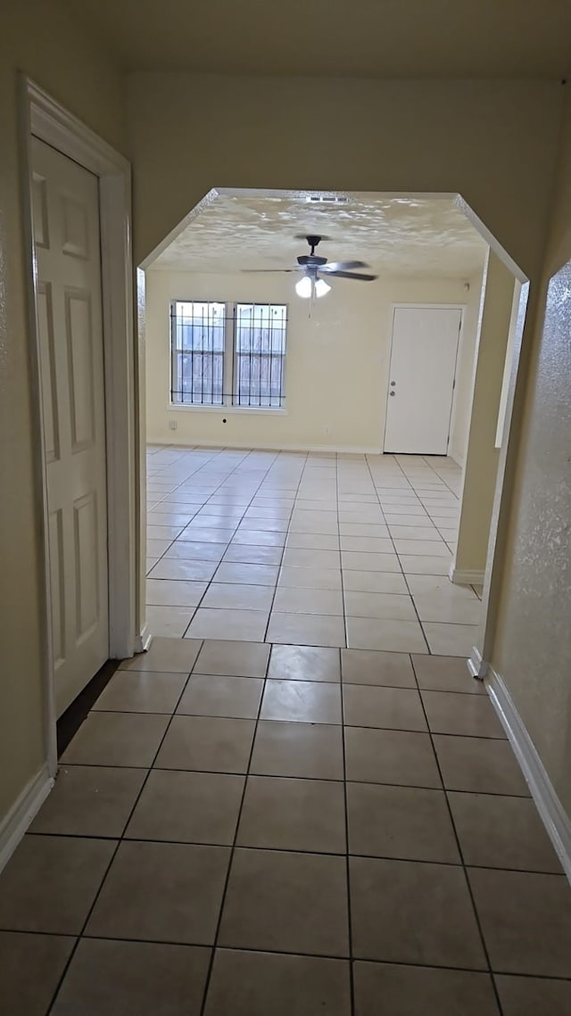 corridor featuring tile patterned floors