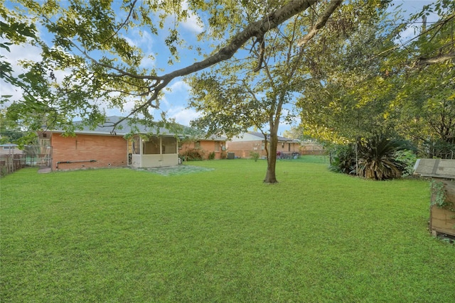 view of yard featuring a sunroom