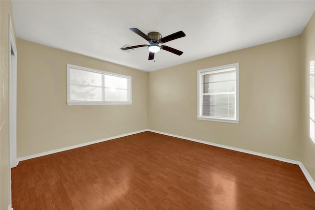 unfurnished room with hardwood / wood-style flooring and ceiling fan