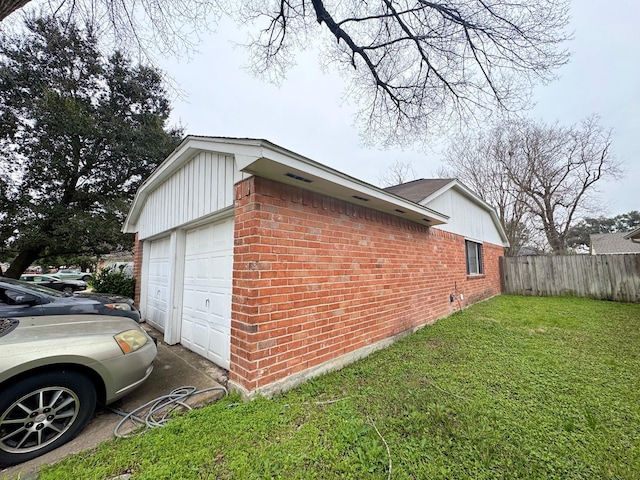 view of side of home with a lawn