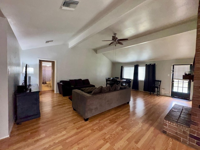 living room with ceiling fan, lofted ceiling with beams, and light hardwood / wood-style flooring