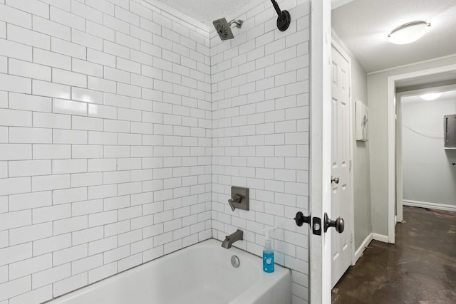 bathroom with a textured ceiling, baseboards, crown molding, and bathing tub / shower combination