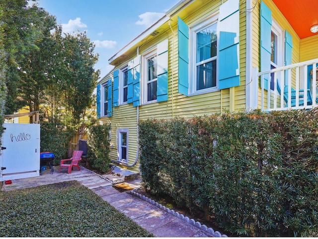 view of side of home with a patio