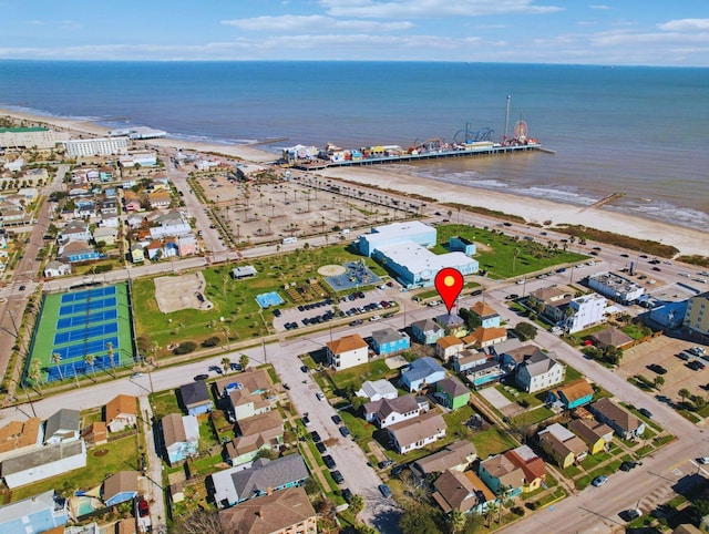 aerial view with a water view and a view of the beach