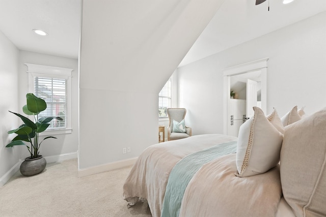 carpeted bedroom featuring vaulted ceiling and ceiling fan