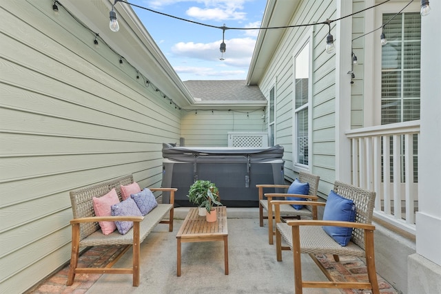 view of patio / terrace featuring a hot tub and an outdoor hangout area