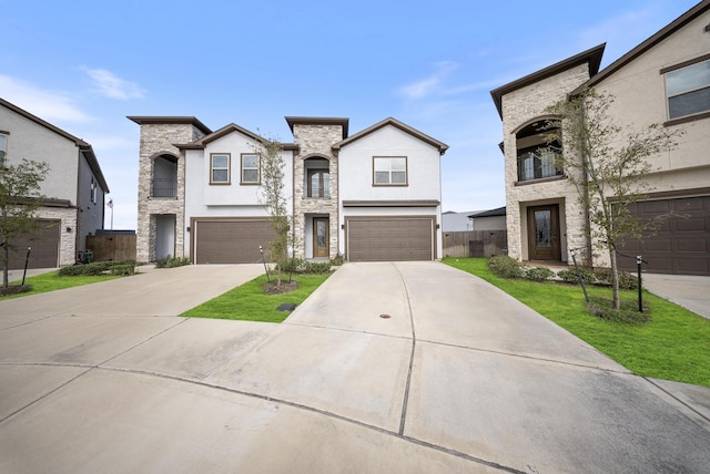 french country inspired facade featuring a garage and a front yard