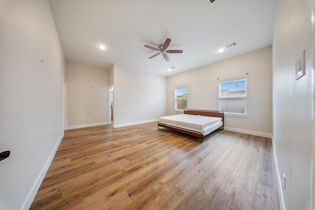 unfurnished bedroom featuring ceiling fan and light wood-type flooring