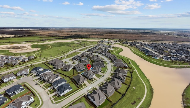 bird's eye view featuring a water view, a residential view, and golf course view