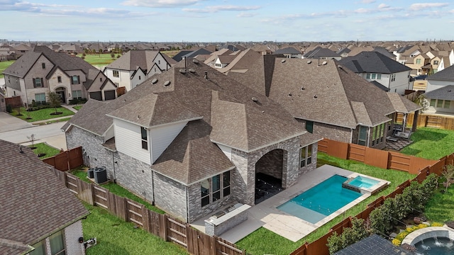 view of pool with a residential view, a fenced backyard, and a patio