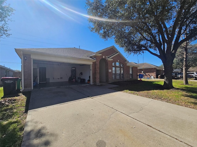 ranch-style house with a garage and a front yard