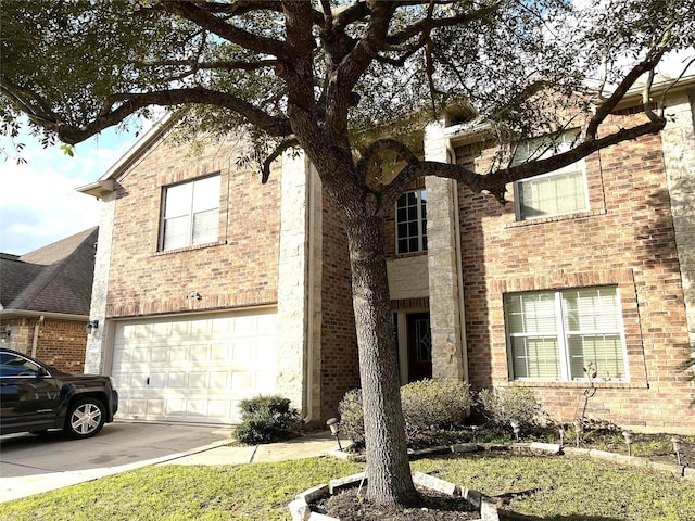 view of front facade with concrete driveway, brick siding, and an attached garage