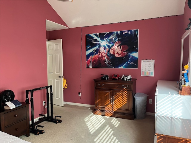 home theater room featuring light carpet, baseboards, and vaulted ceiling