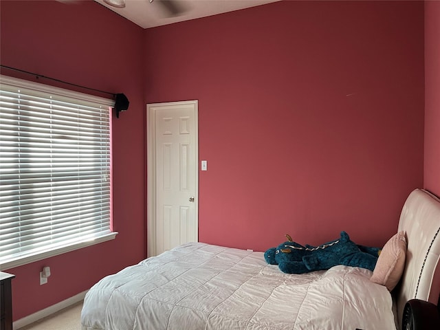 bedroom with baseboards and carpet flooring