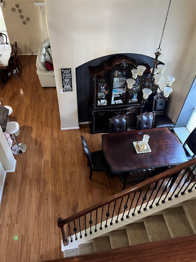 staircase featuring wood finished floors
