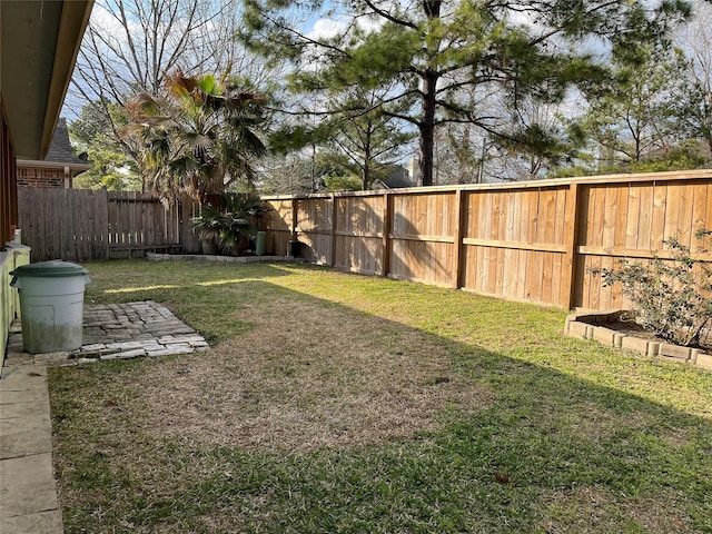 view of yard with a fenced backyard