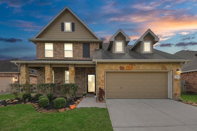 view of front of home with a garage, a lawn, and a porch