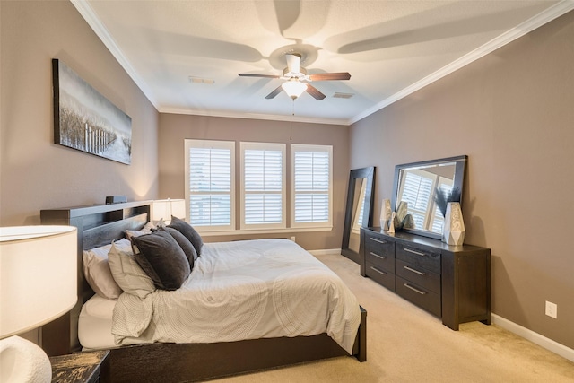 carpeted bedroom with crown molding and ceiling fan