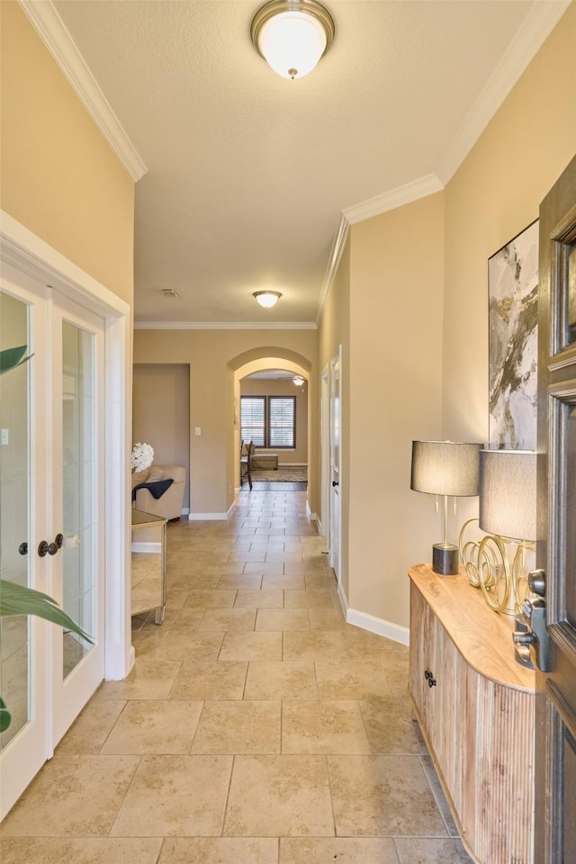 corridor with crown molding and french doors