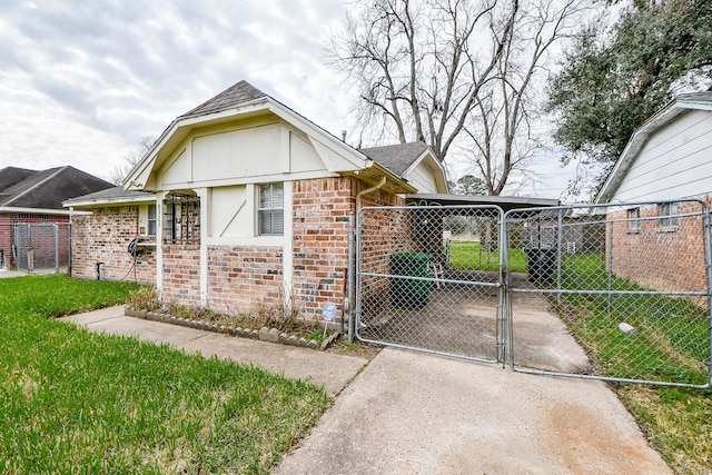 8323 Ponnel Ln, Houston, TX 77088 - view of front of home featuring fence, a gate, concrete driveway, and a front lawn