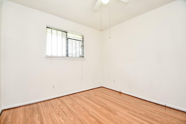 unfurnished room featuring ceiling fan and light wood-type flooring