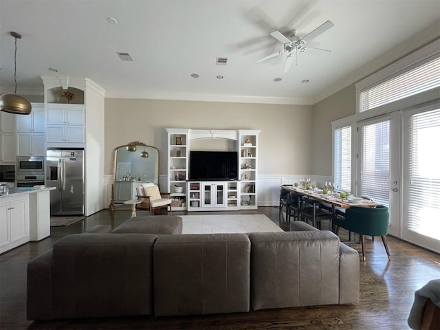 living room featuring crown molding, dark hardwood / wood-style floors, and ceiling fan